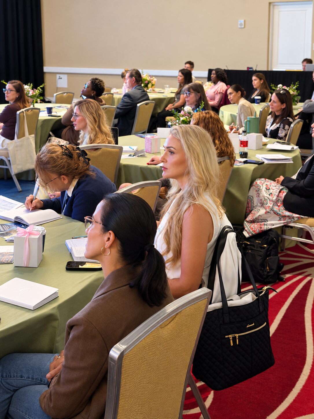 Attendees engaged at round tables